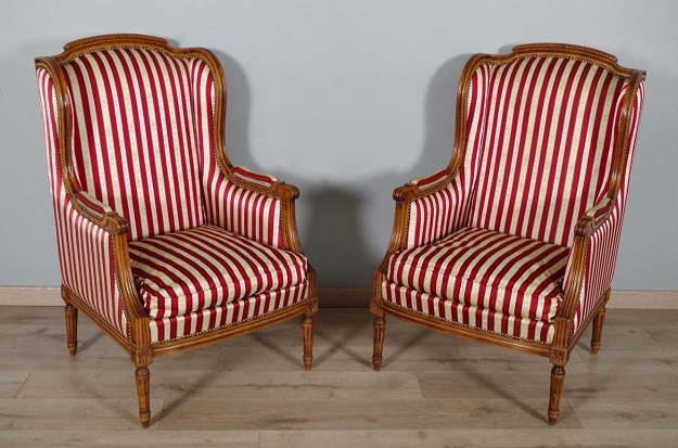 Arriving in Future Shipment - French Louis XVI Style Walnut Bergères à Oreilles with Fluted Legs, a Pair