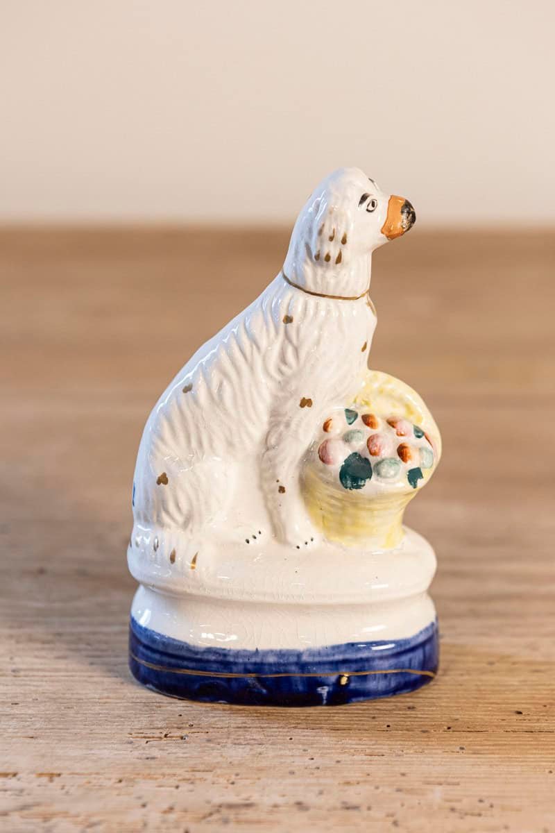 English 20th Century Petite Michael Davis Porcelain Dog with Fruit Basket and Blue Oval Base - JAA