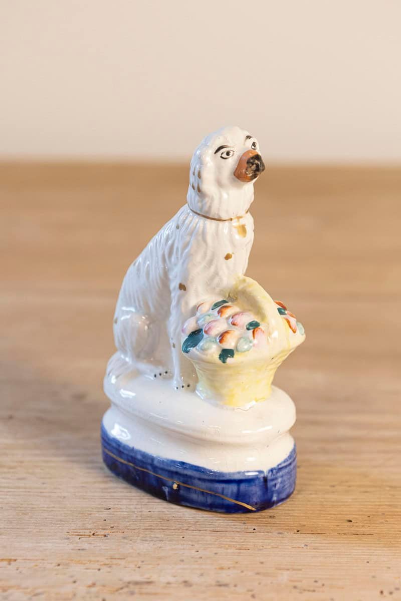 English 20th Century Petite Michael Davis Porcelain Dog with Fruit Basket and Blue Oval Base - JAA