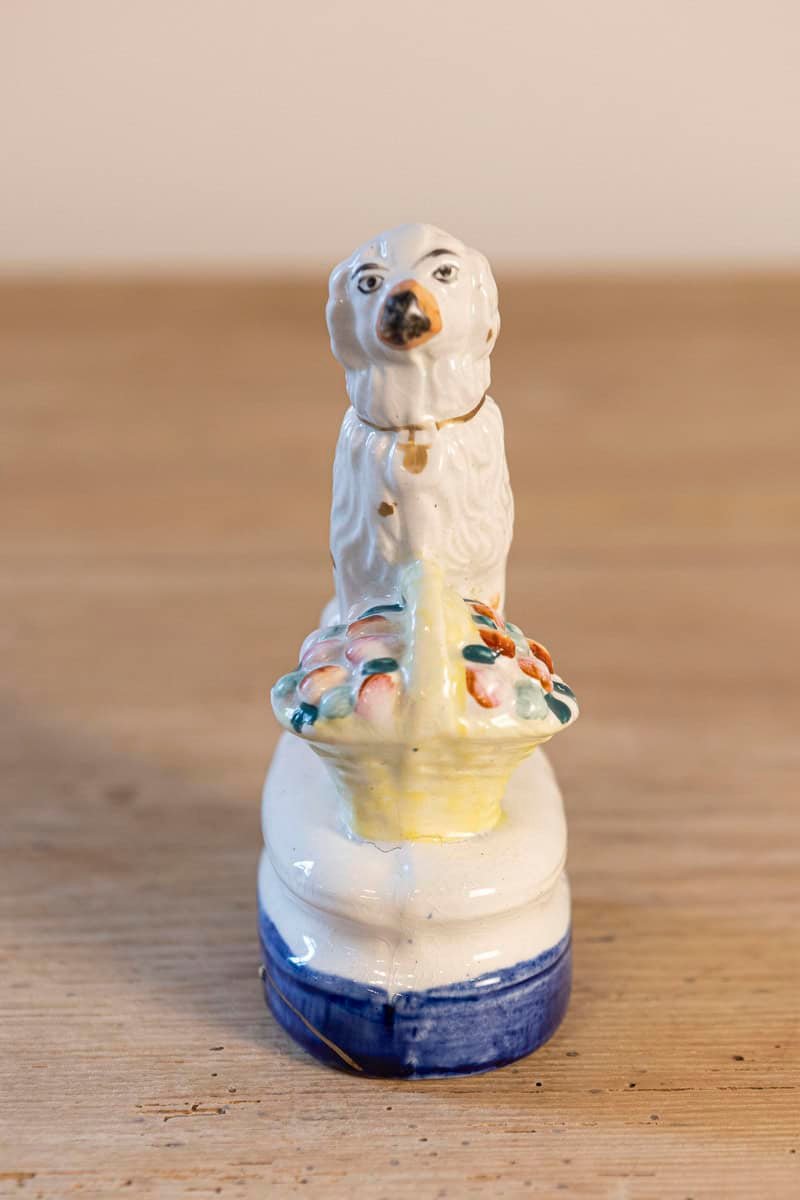 English 20th Century Petite Michael Davis Porcelain Dog with Fruit Basket and Blue Oval Base - JAA