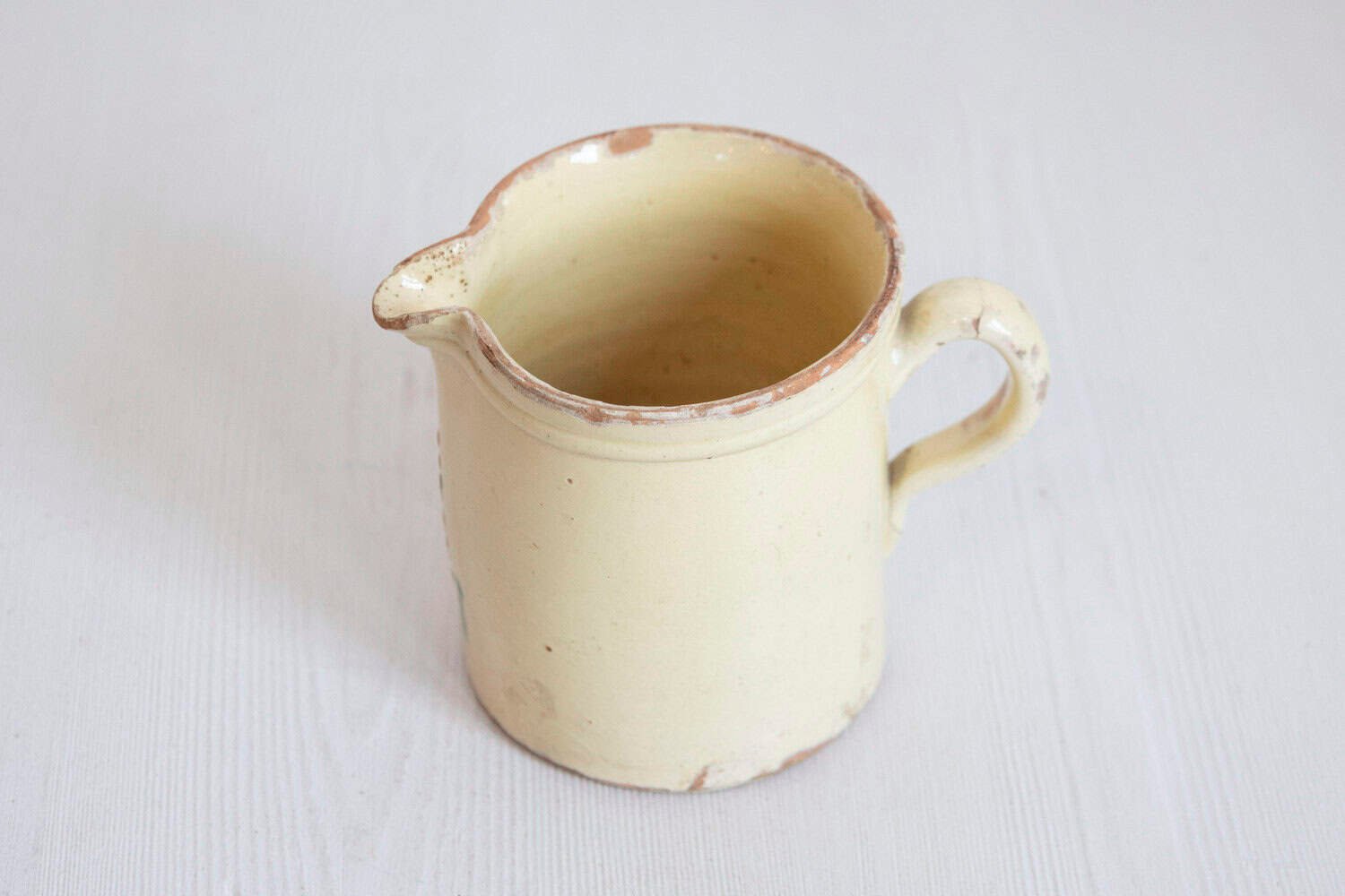 French 19th Century Cream Glazed Terracotta Pitcher with Floral Décor - JAA
