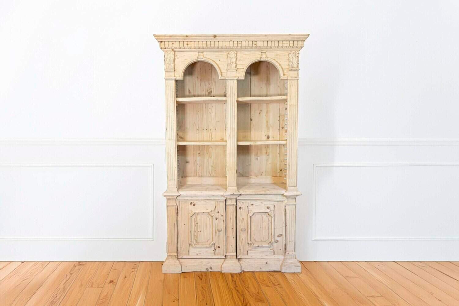 Italian Neoclassical Style Carved Pine Bookcase with Arched Motifs and Capitals - JAA