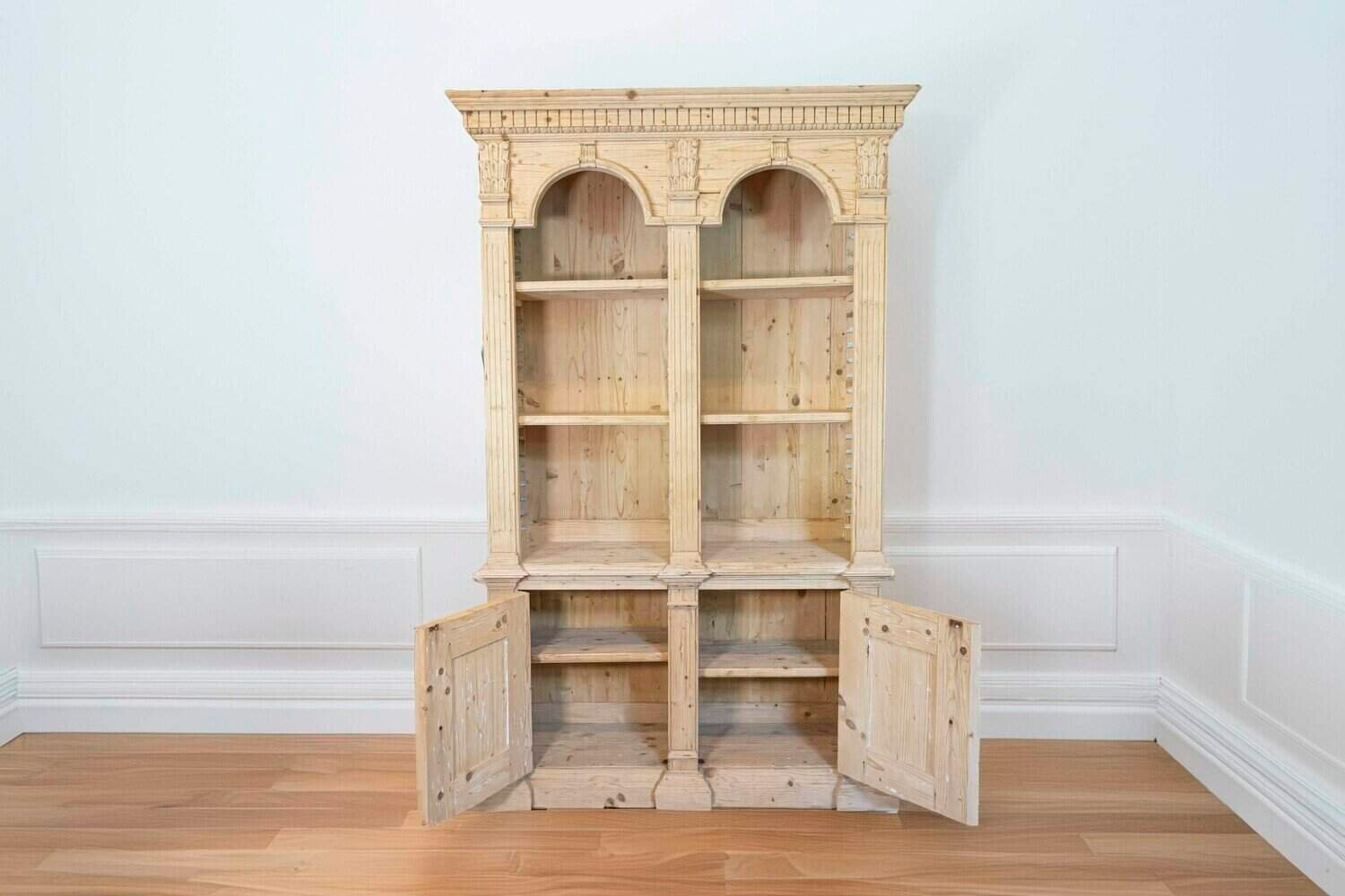 Italian Neoclassical Style Carved Pine Bookcase with Arched Motifs and Capitals - JAA