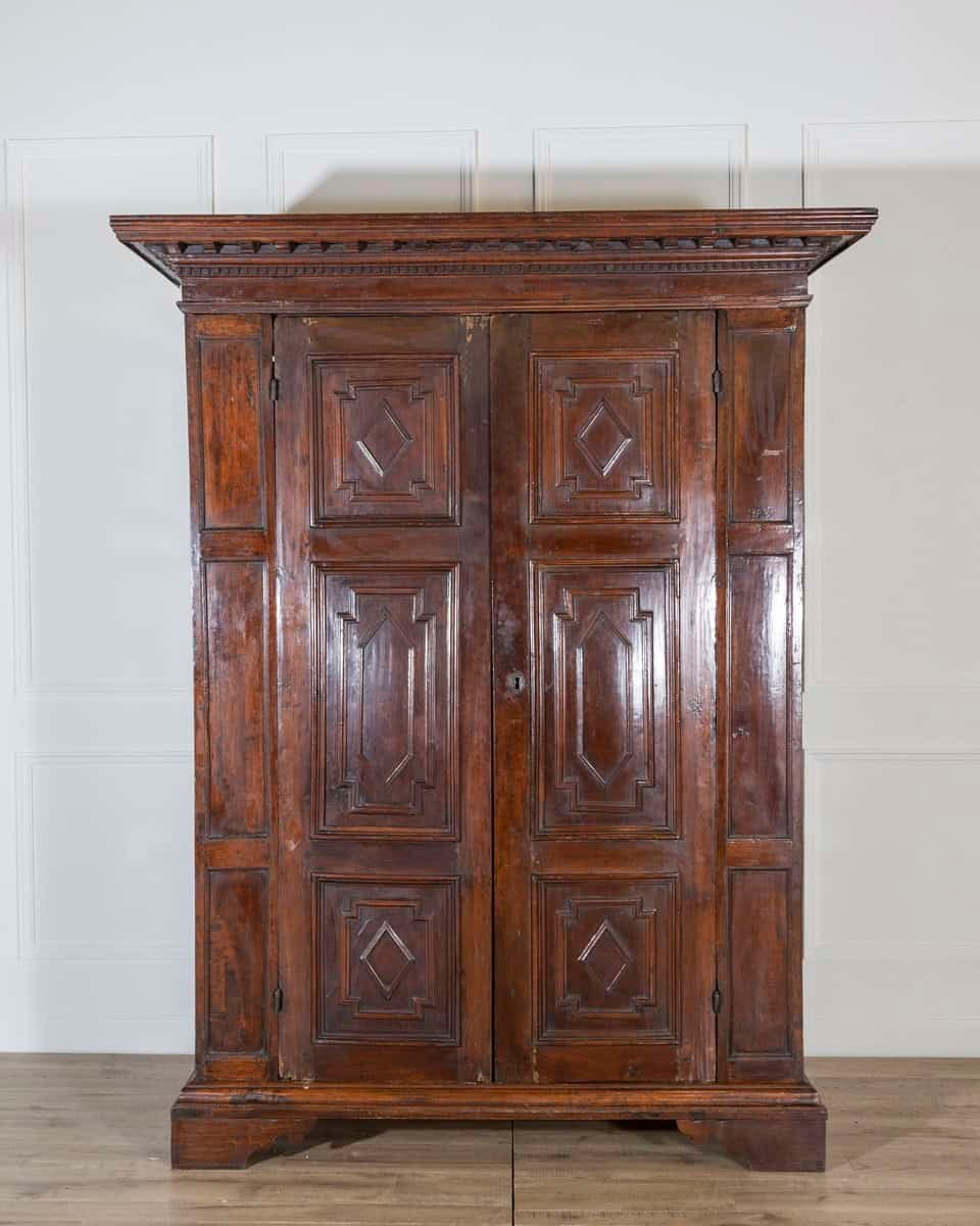 Italian 17th Century Lombard Walnut Wardrobe with Carved Pilasters, Molded Panels and Bracket Feet - JAA