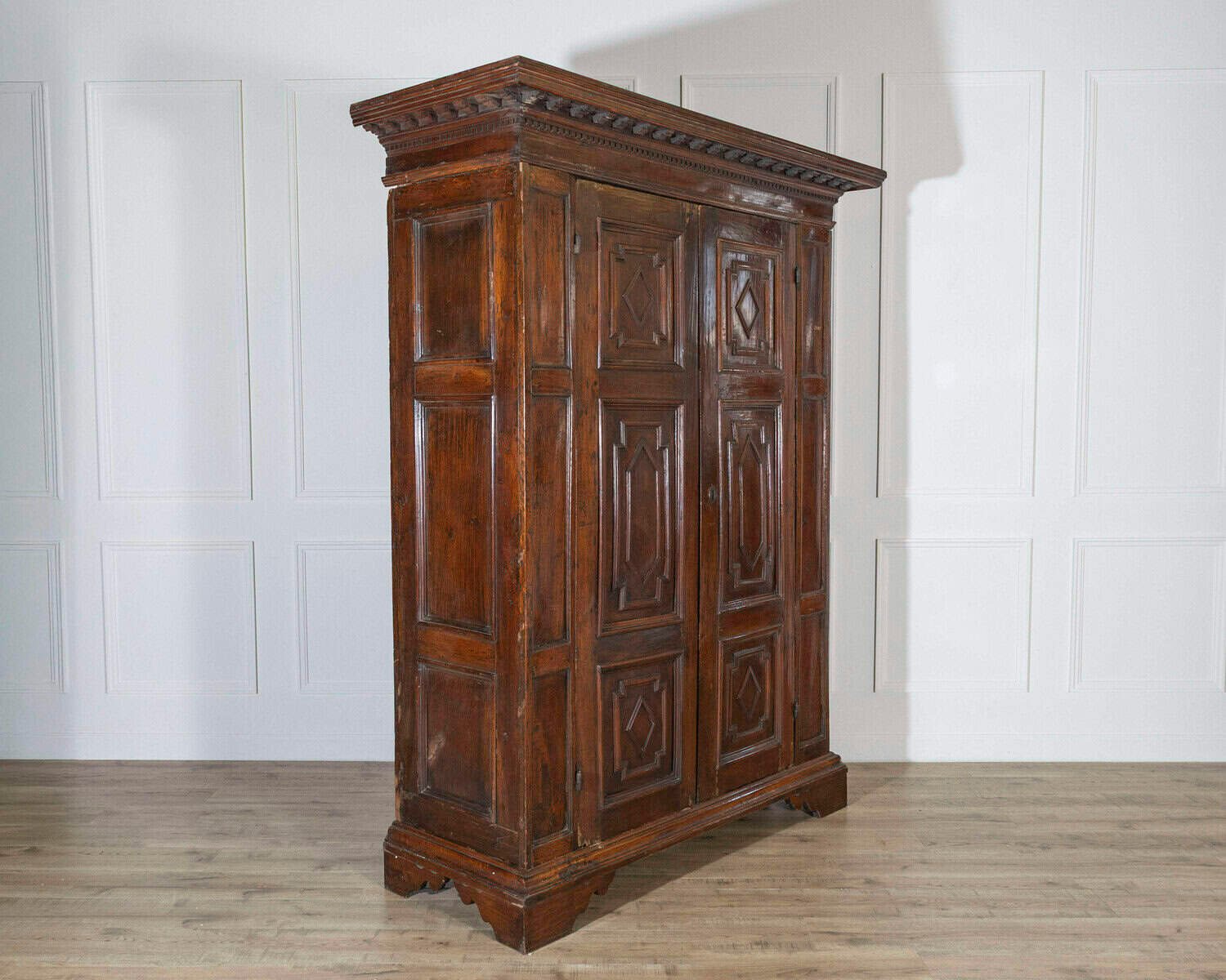 Italian 17th Century Lombard Walnut Wardrobe with Carved Pilasters, Molded Panels and Bracket Feet - JAA