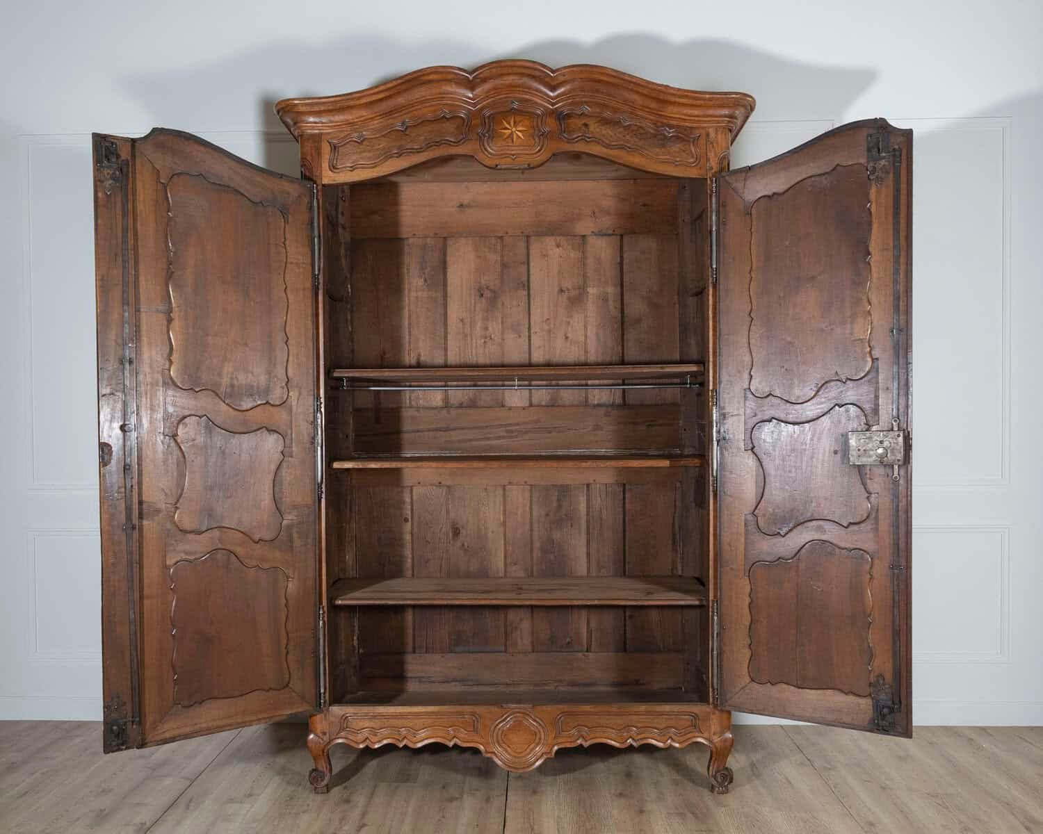 French 18th Century Lyonnaise Walnut Armoire with Double Arched Cornice and Star Motif - JAA