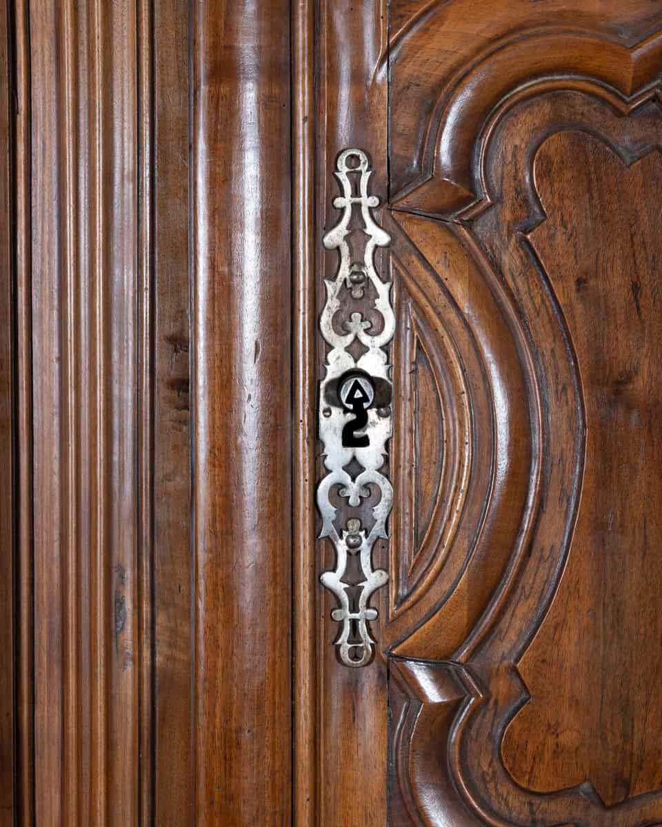 French 18th Century Lyonnaise Walnut Armoire with Double Arched Cornice and Star Motif - JAA