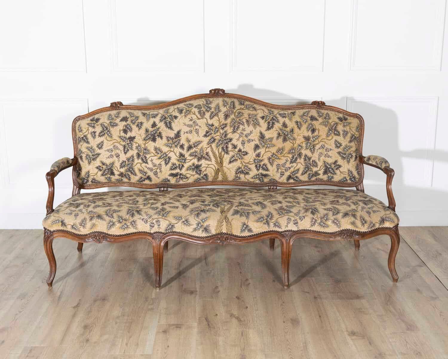 18th Century Louis XV Period Walnut Sofa with Floral Carvings and Tapestry Upholstery - JAA