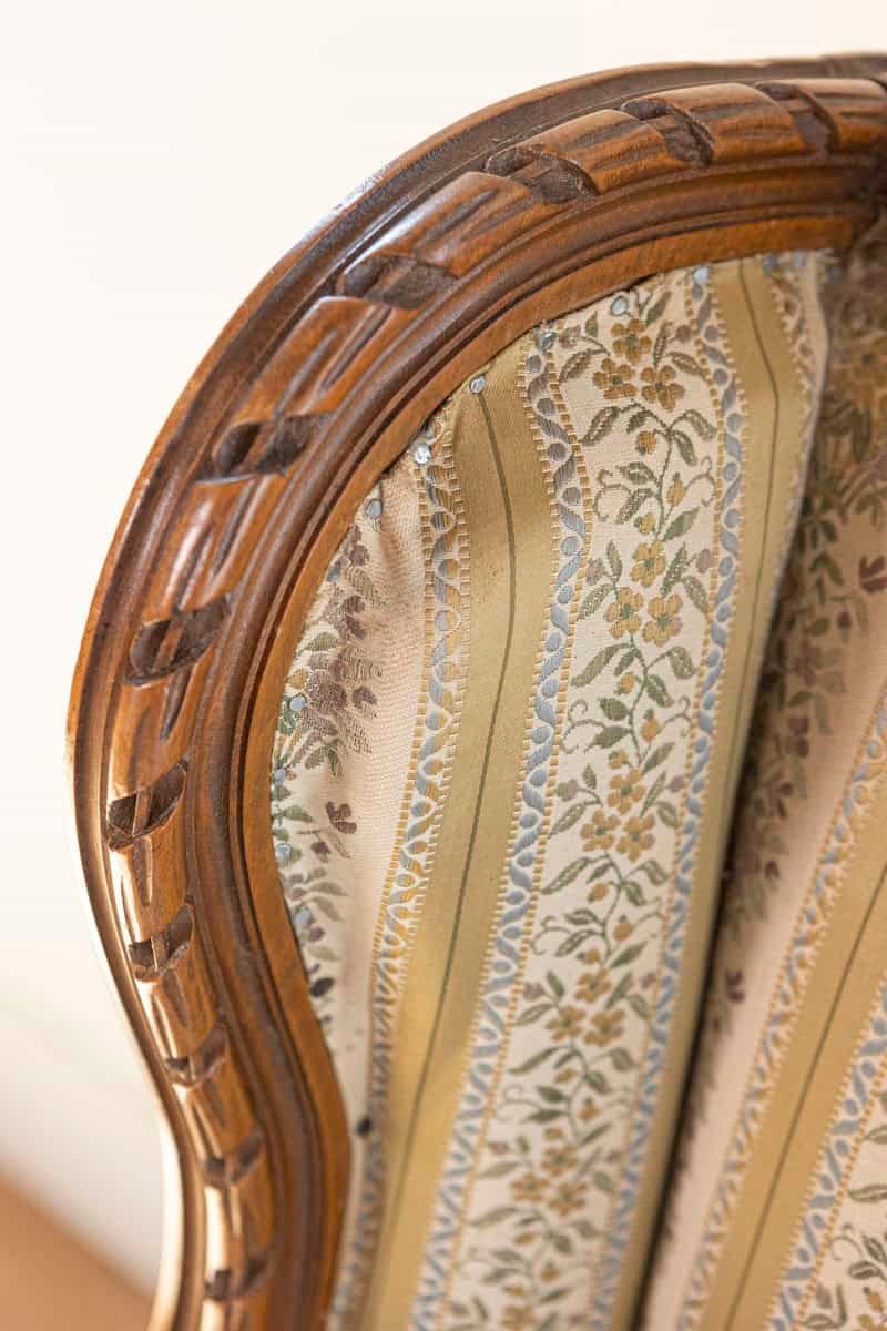 French Louis XVI Style 19th Century Walnut Bergère à Oreilles with Carved Roses - JAA