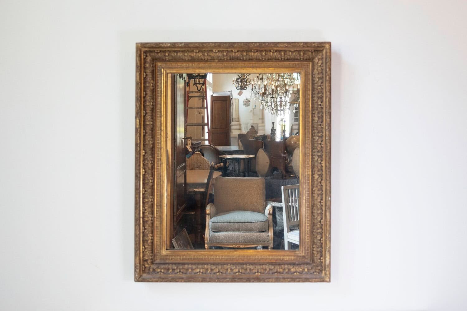 French 20th Century Gilded Mirror with Carved Foliage Motifs and Beads - JAA