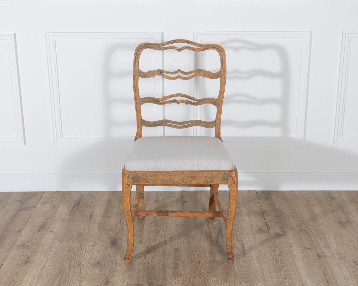 A pair of slender Gustavian chairs with smiling details, scraped to original paint and newly covered in linen. Circa 1780 - JAA