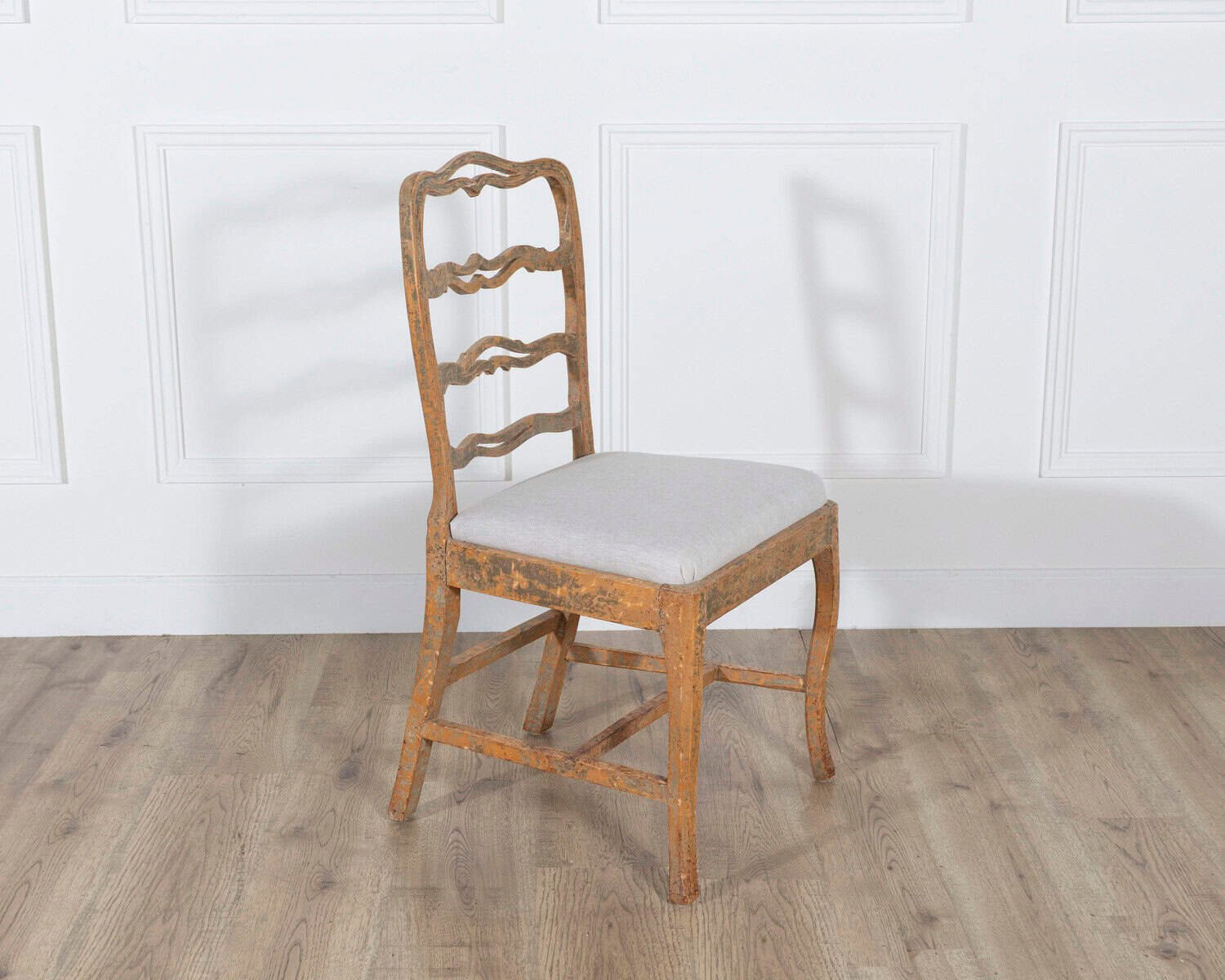 A pair of slender Gustavian chairs with smiling details, scraped to original paint and newly covered in linen. Circa 1780 - JAA