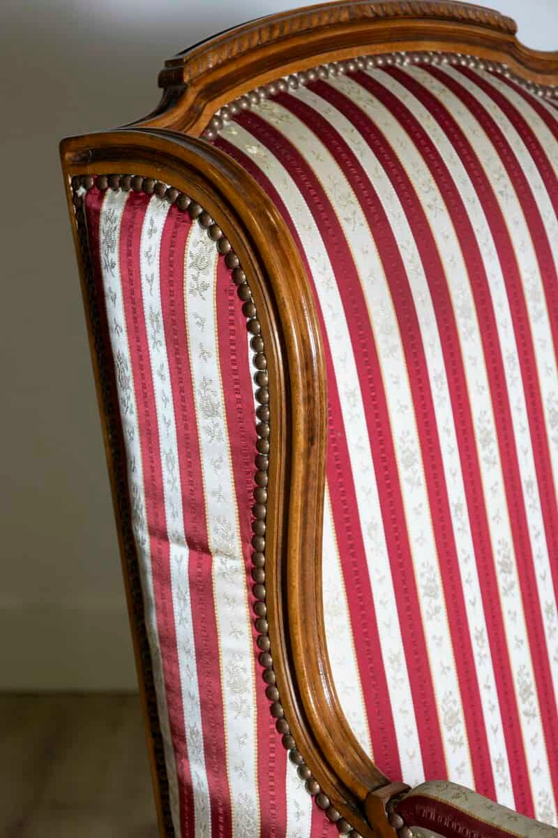 French Louis XVI Style Walnut Bergères à Oreilles with Fluted Legs, a Pair - JAA