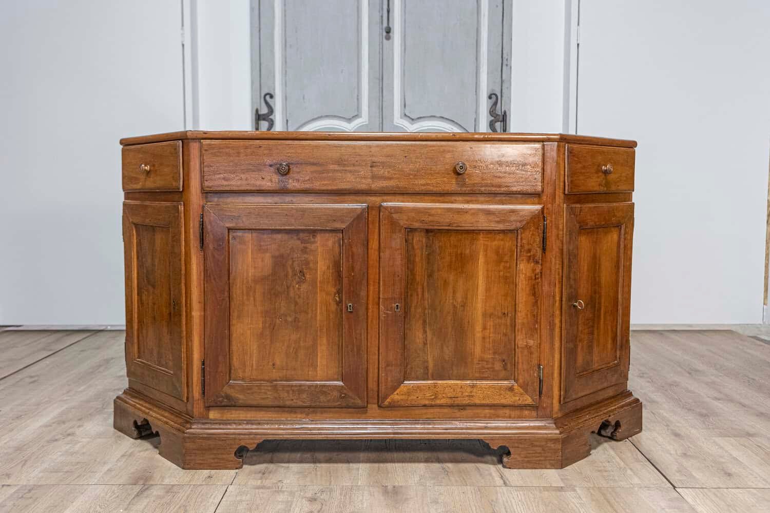 Italian 19th Century Walnut Credenza with Drawers over Doors and Canted Sides - JAA
