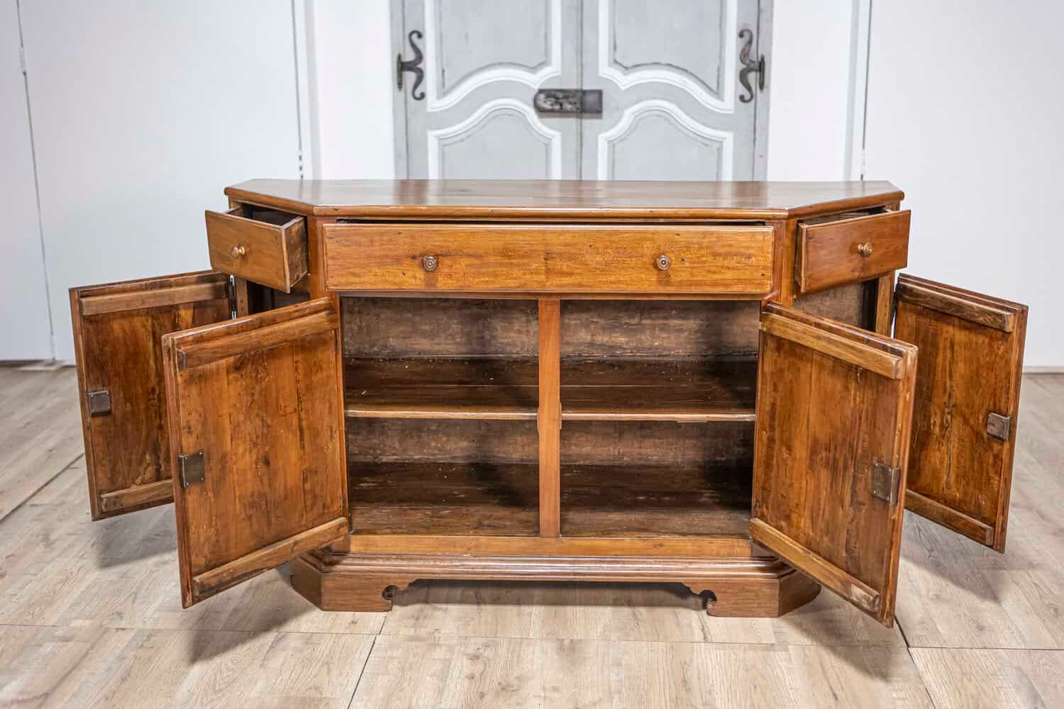 Italian 19th Century Walnut Credenza with Drawers over Doors and Canted Sides - JAA