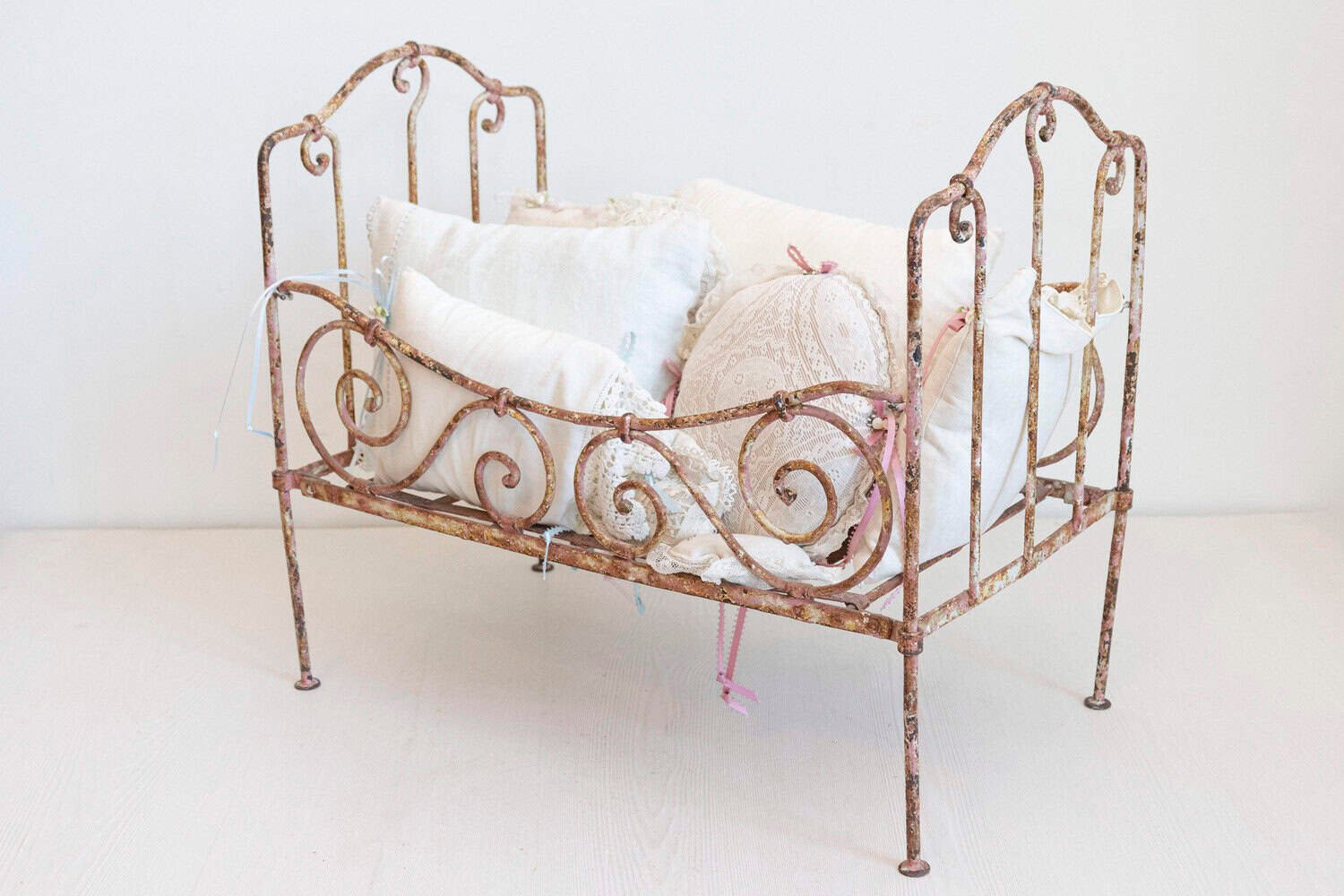 Assortment of Vintage Lace Pillows in 19th Century Metal Crib with Great Patina - JAA