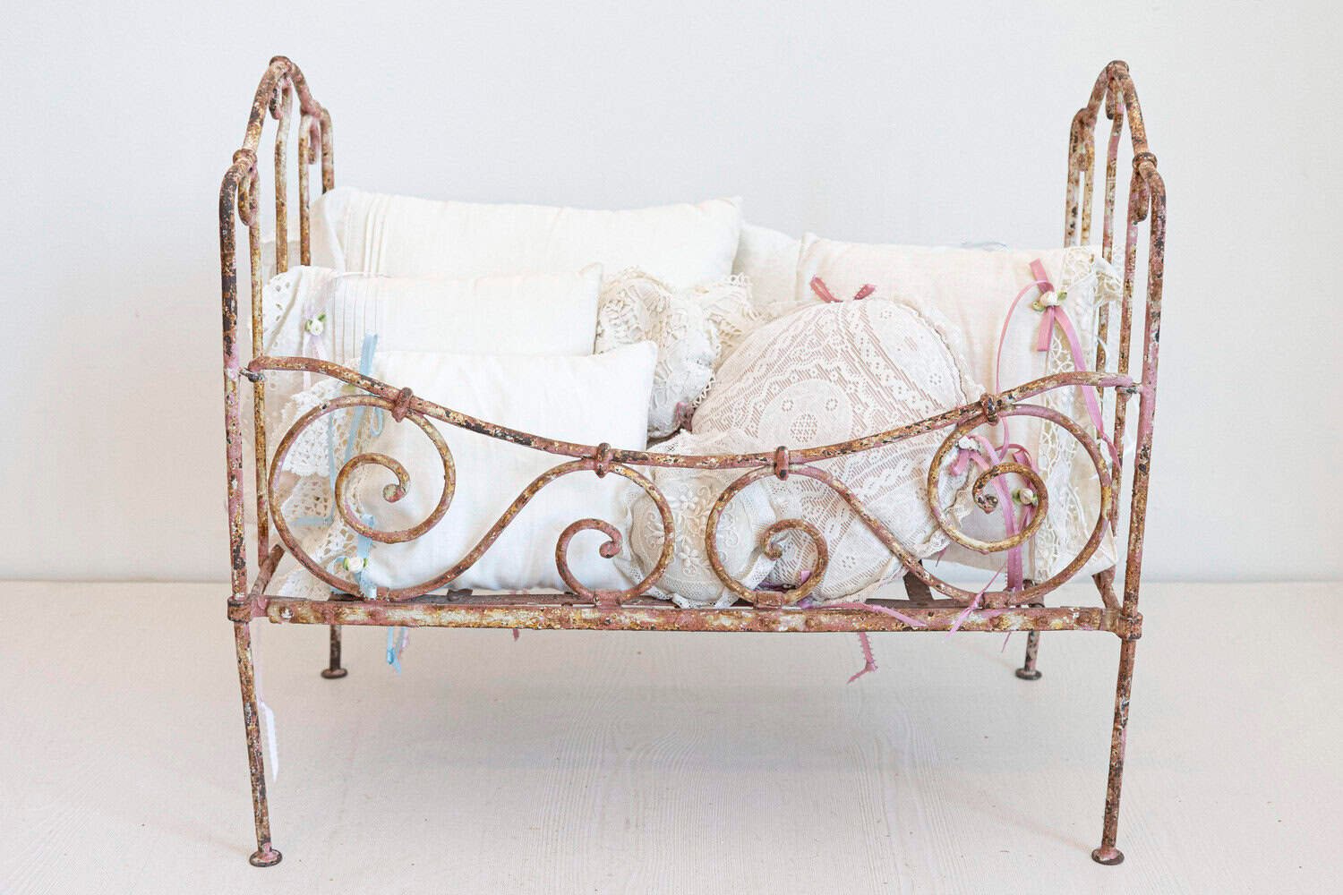 Assortment of Vintage Lace Pillows in 19th Century Metal Crib with Great Patina - JAA
