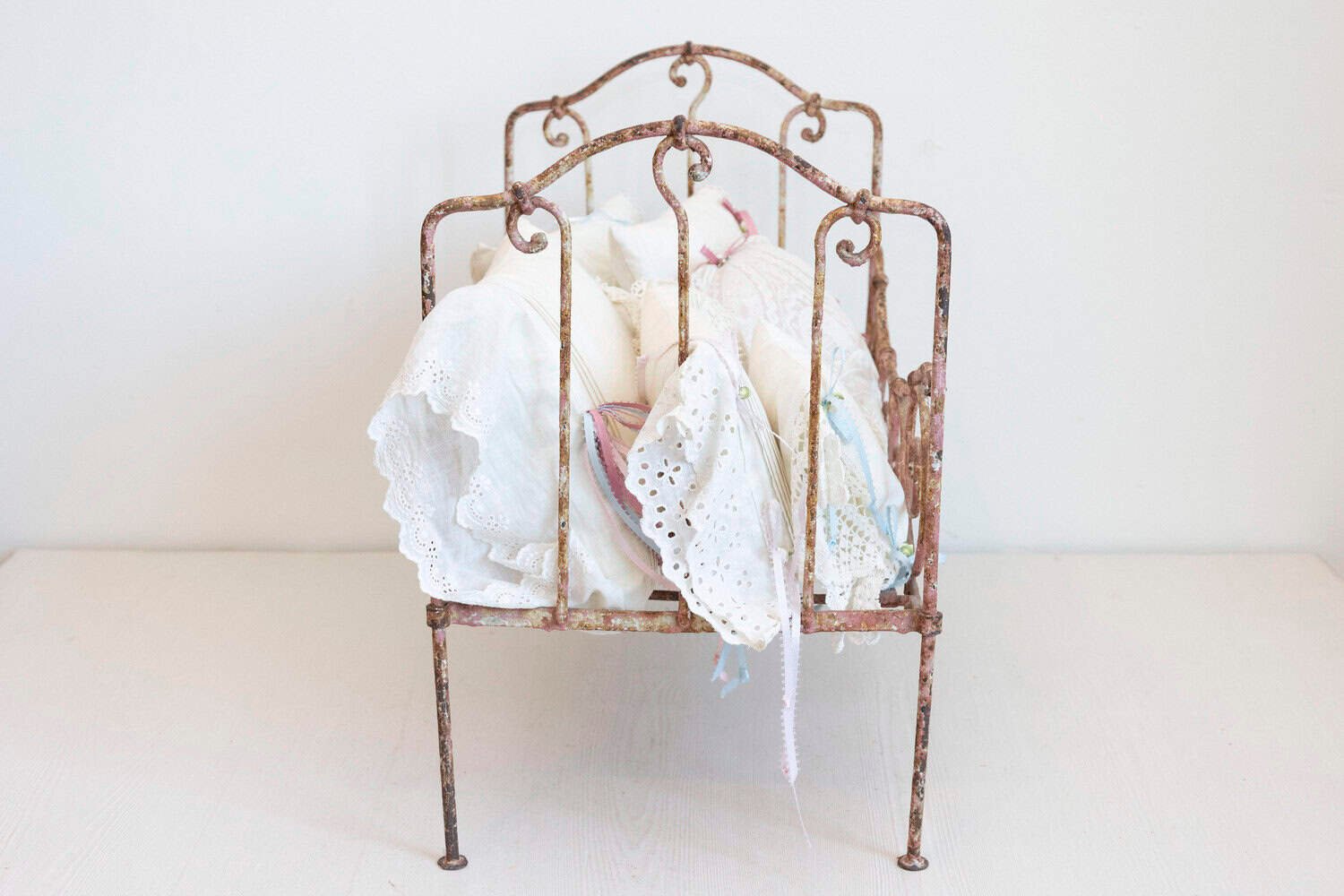 Assortment of Vintage Lace Pillows in 19th Century Metal Crib with Great Patina - JAA