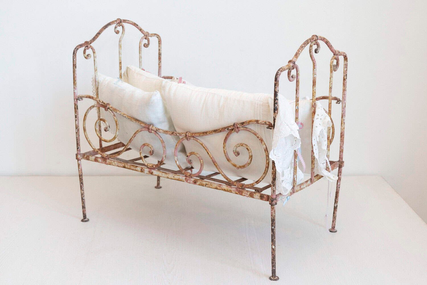 Assortment of Vintage Lace Pillows in 19th Century Metal Crib with Great Patina - JAA