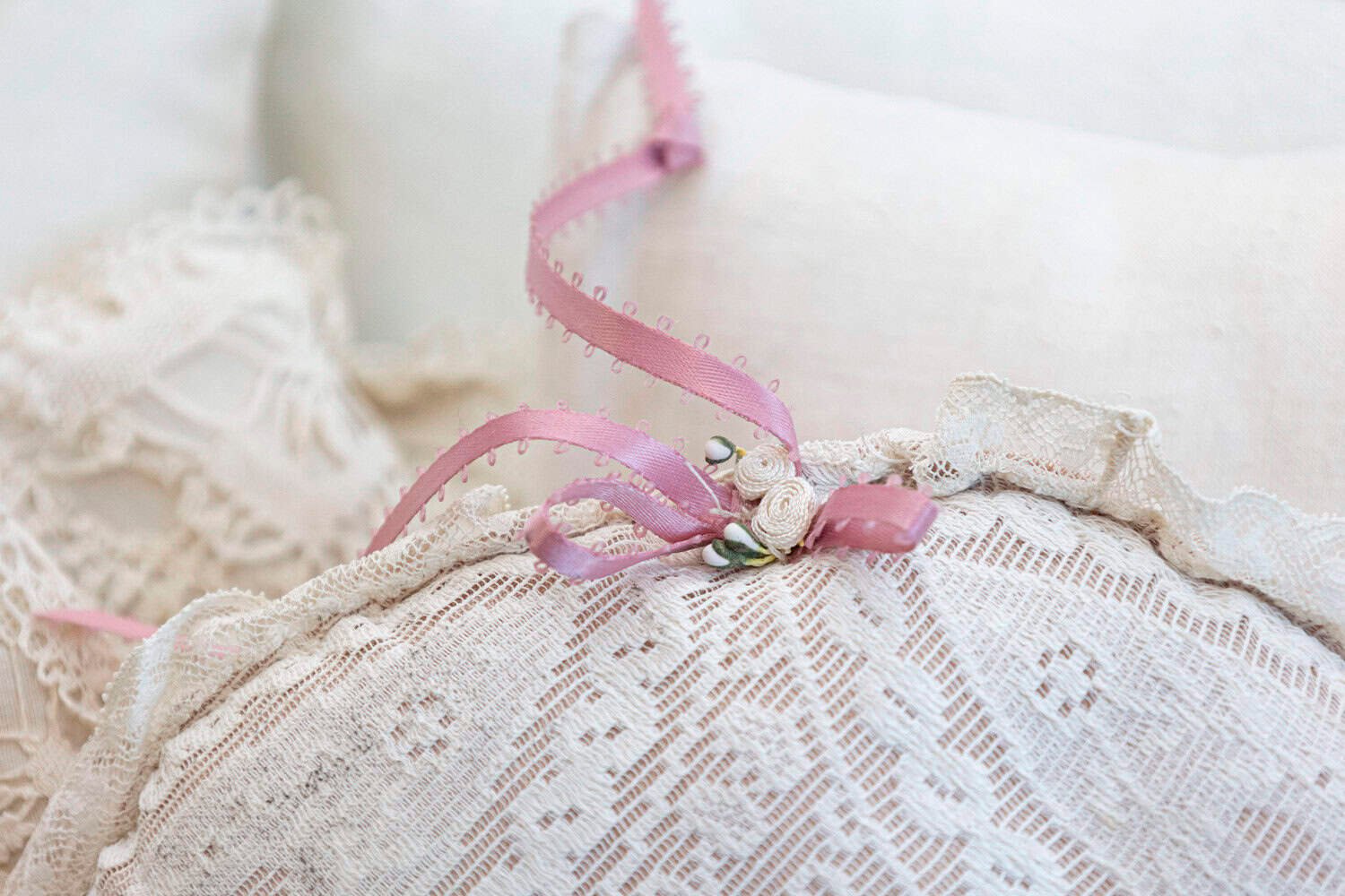 Assortment of Vintage Lace Pillows in 19th Century Metal Crib with Great Patina - JAA