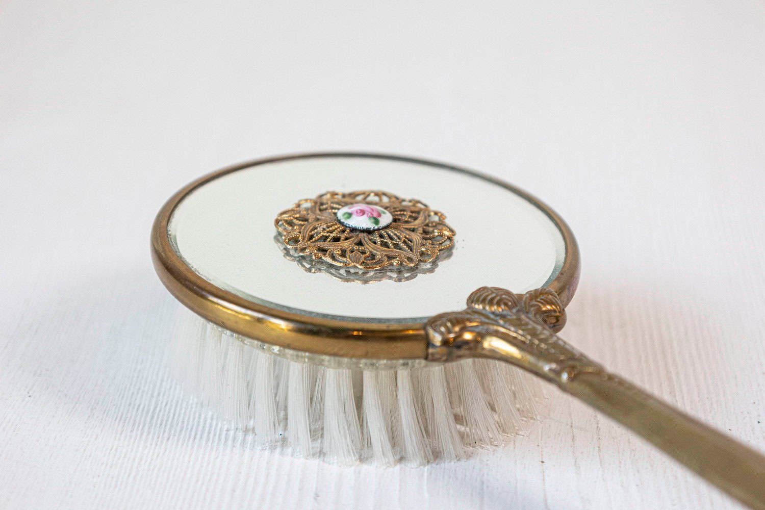 English 20th Century Mirrored Hair Brush with Brass Handle, Filigree Volute Décor and Painted Floral Medallion - JAA