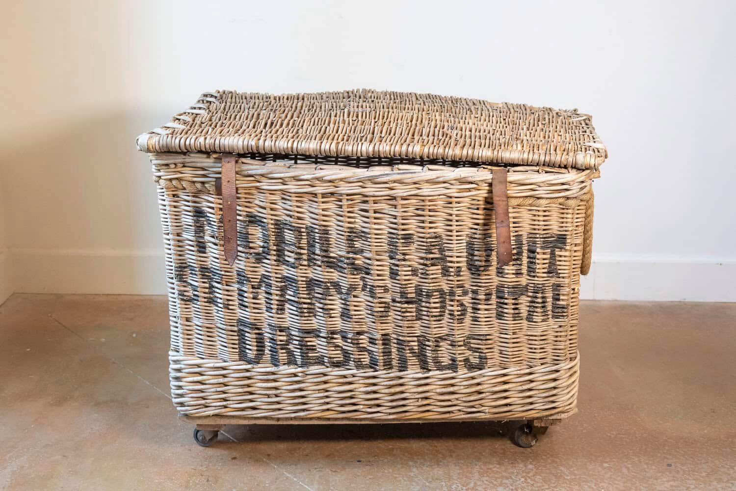 English Early 20th Century Wicker Laundry Basket on Wheels with Stenciled Labeling - JAA
