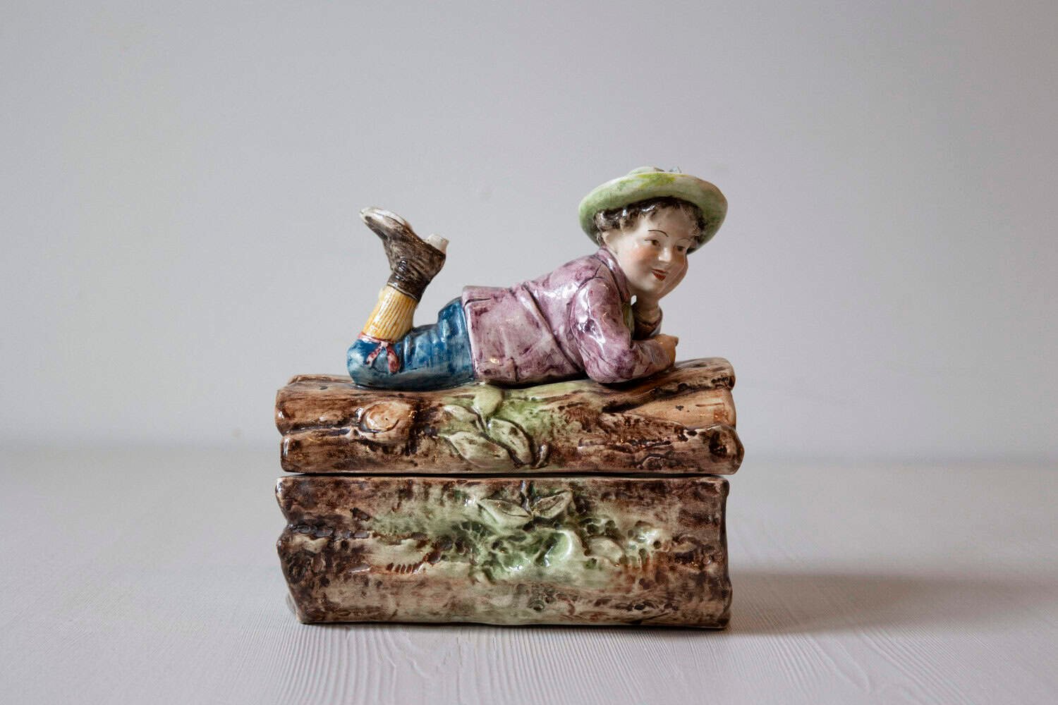 French 19th Century Barbotine Bonbon Box Depicting a Boy Laying on a Tree Trunk - JAA