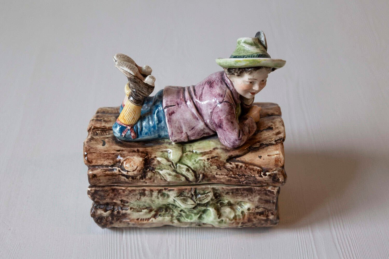 French 19th Century Barbotine Bonbon Box Depicting a Boy Laying on a Tree Trunk - JAA