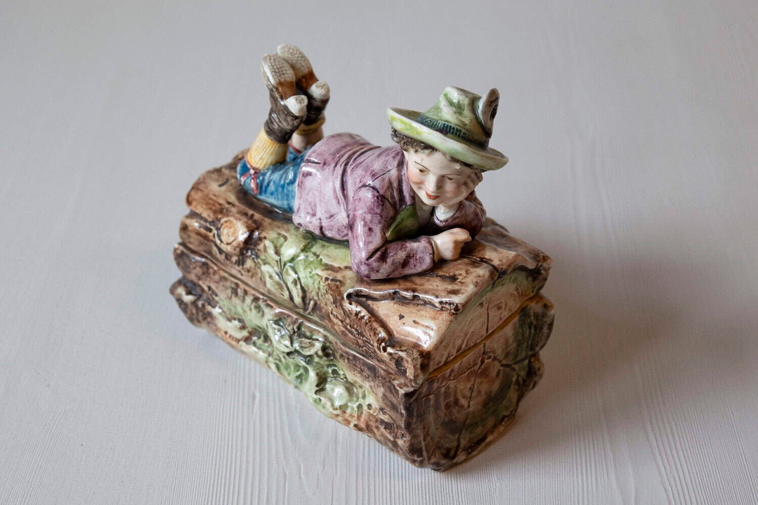 French 19th Century Barbotine Bonbon Box Depicting a Boy Laying on a Tree Trunk - JAA