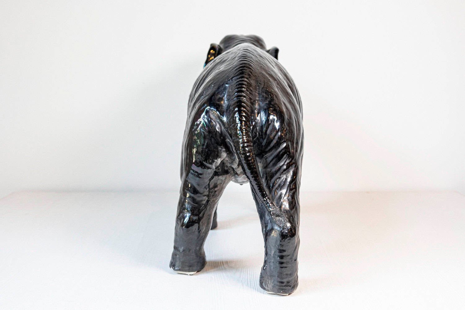 Italian 20th Century Black Glazed Ceramic Sculpture of a Walking Elephant with Trunk Up - JAA