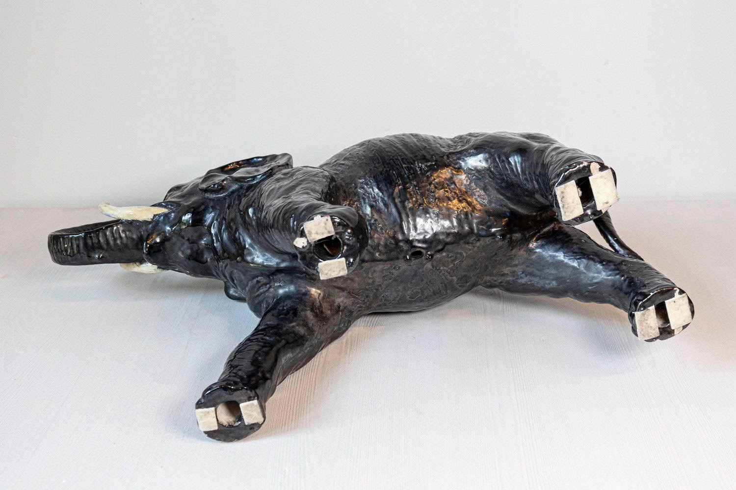 Italian 20th Century Black Glazed Ceramic Sculpture of a Walking Elephant with Trunk Up - JAA