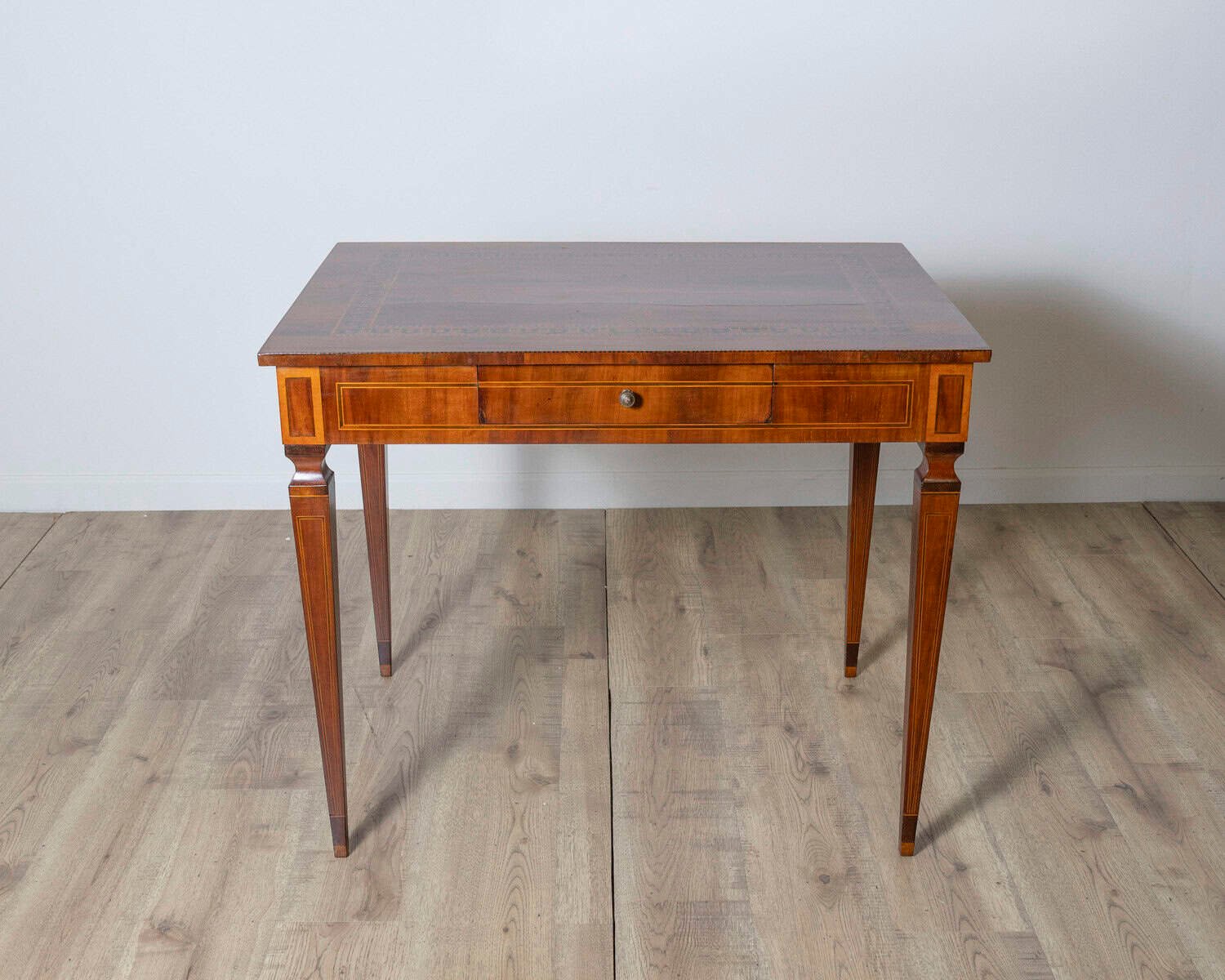 A very elegant walnut table/desk with a central drawer - JAA