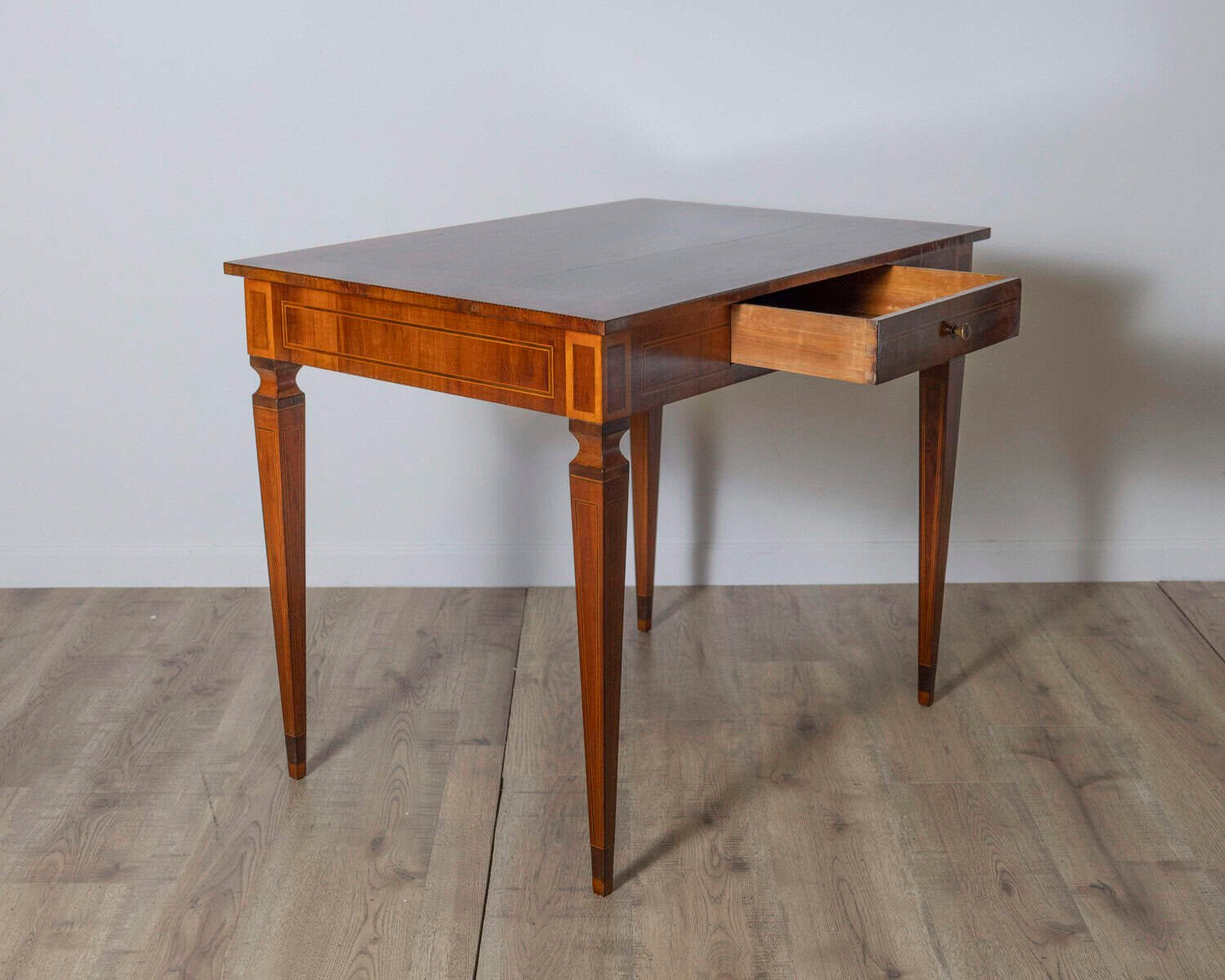 A very elegant walnut table/desk with a central drawer - JAA