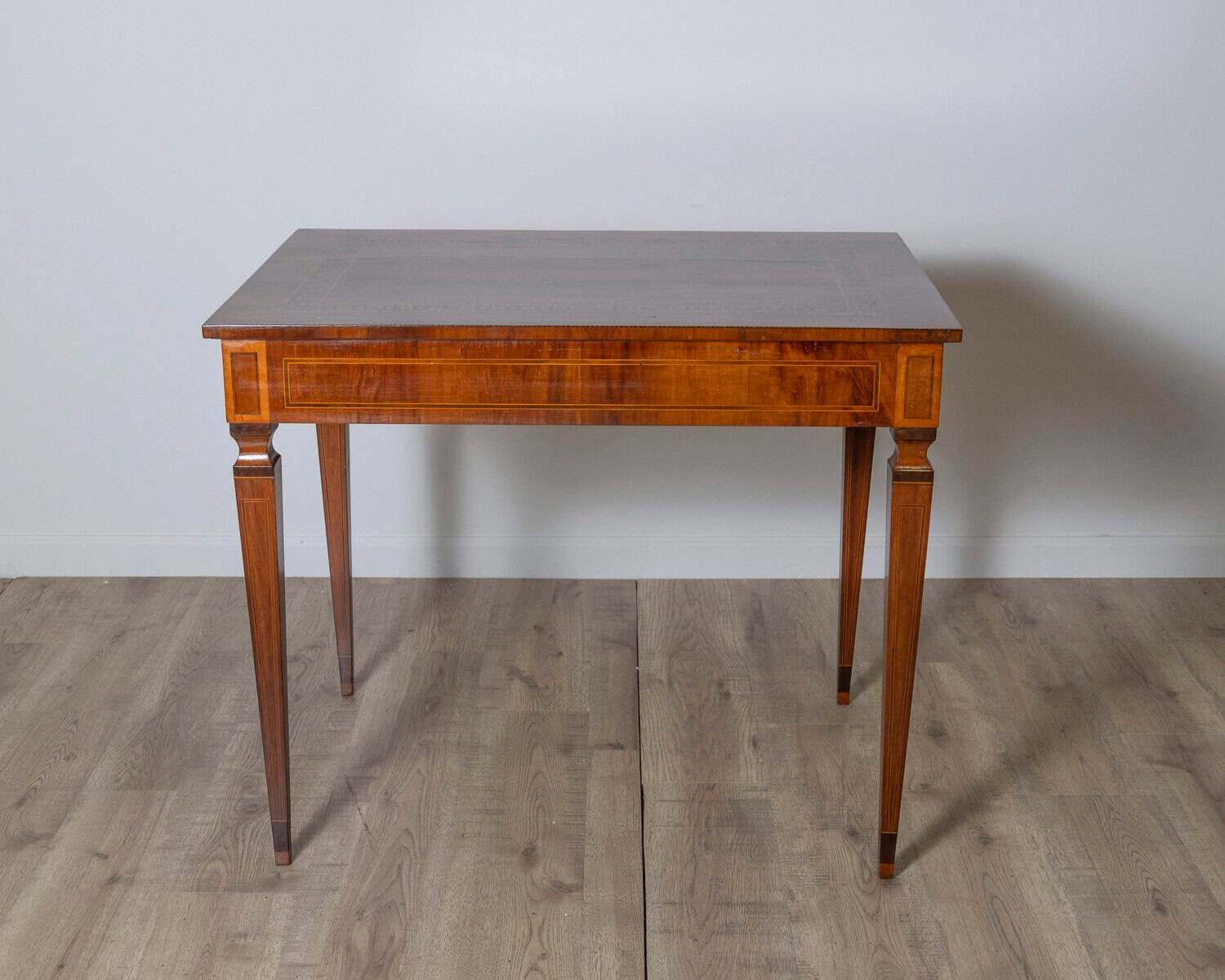 A very elegant walnut table/desk with a central drawer - JAA