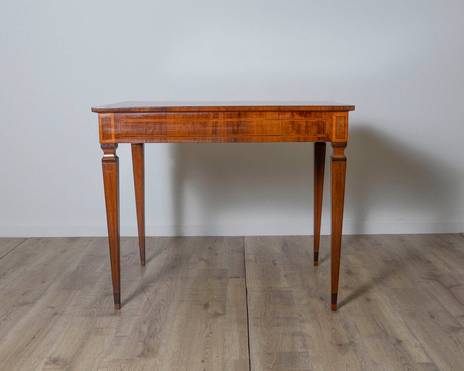A very elegant walnut table/desk with a central drawer - JAA