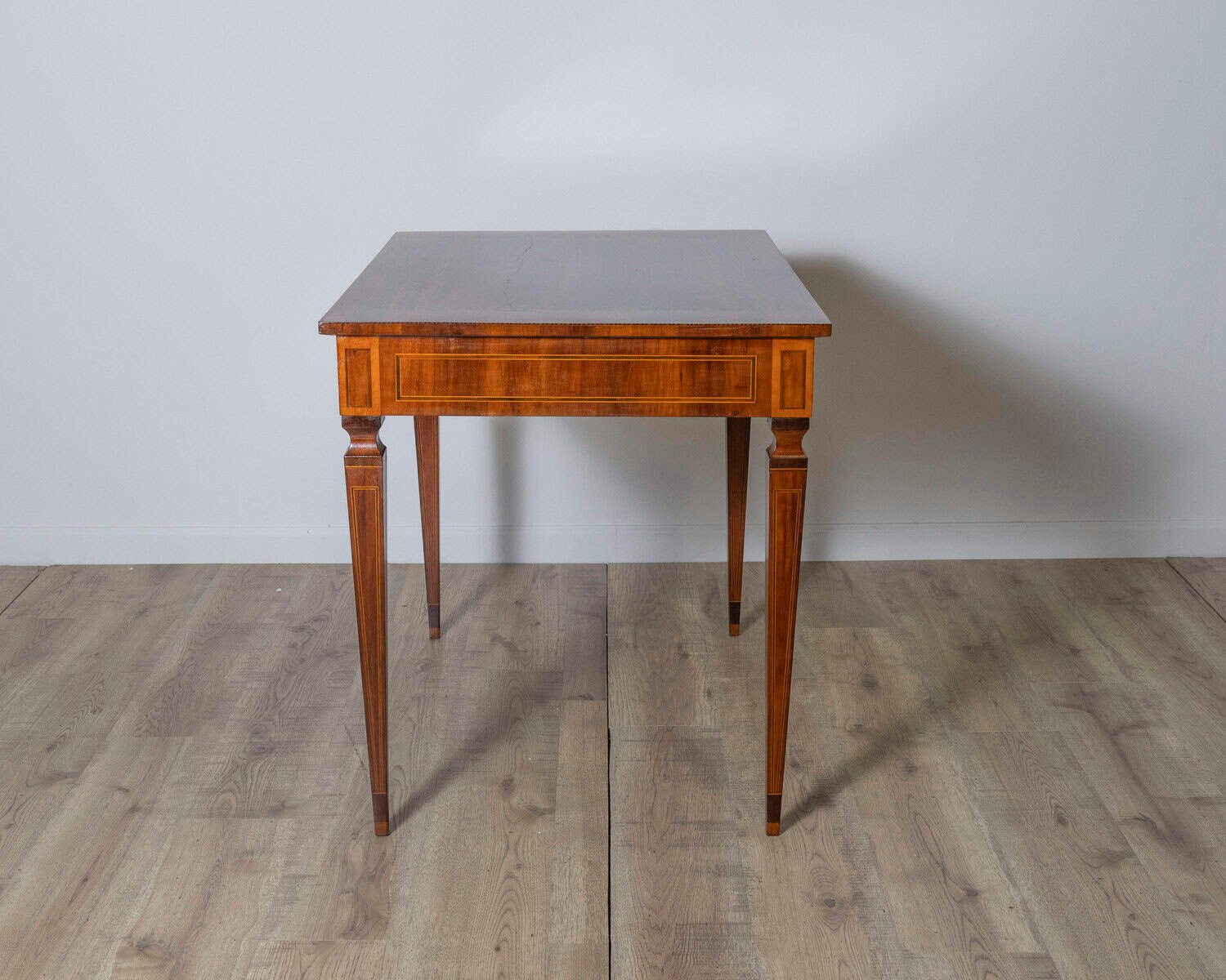 A very elegant walnut table/desk with a central drawer - JAA