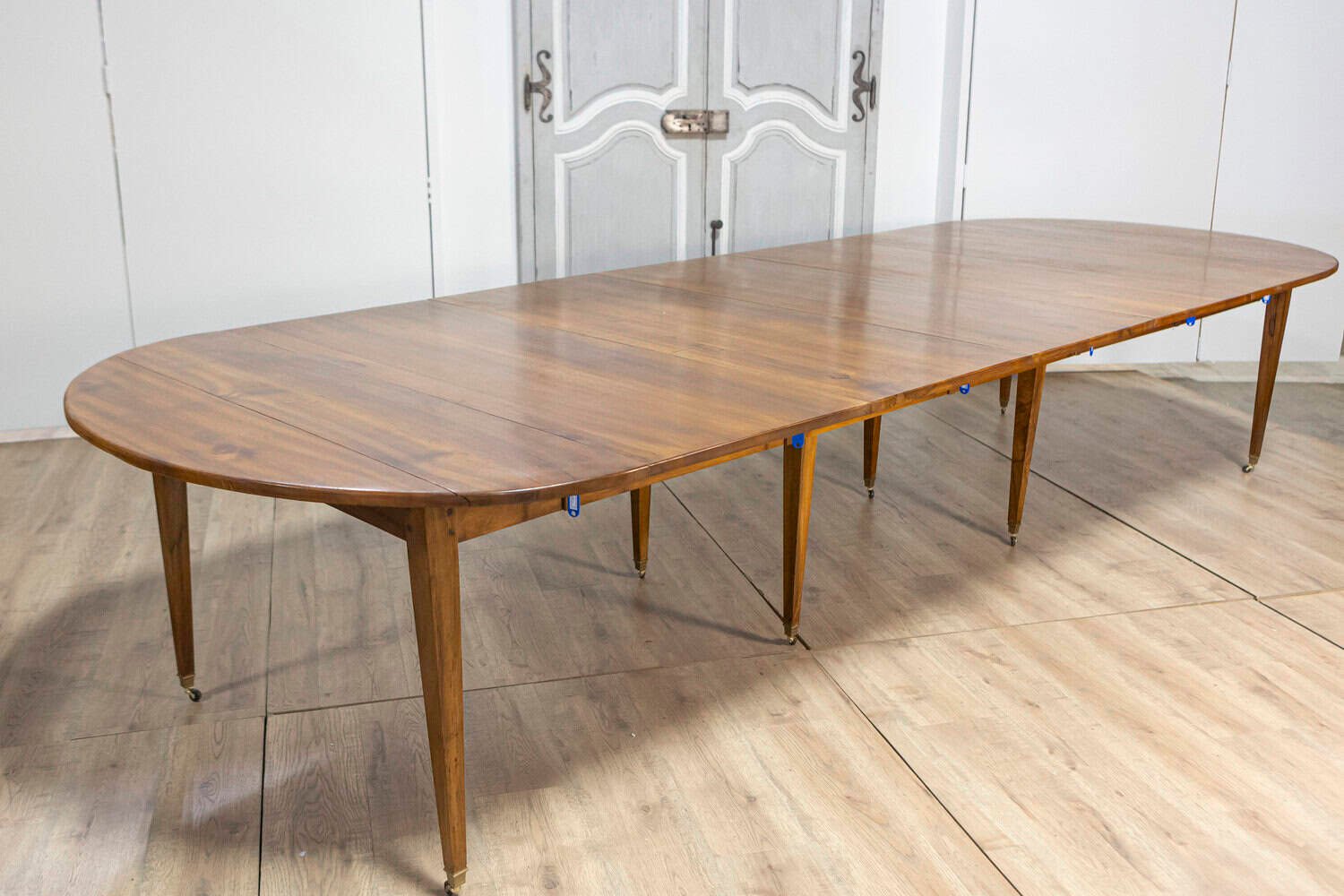 20th Century French Walnut Extension Dining Table With Five Leaves, Tapered Legs on Casters - JAA