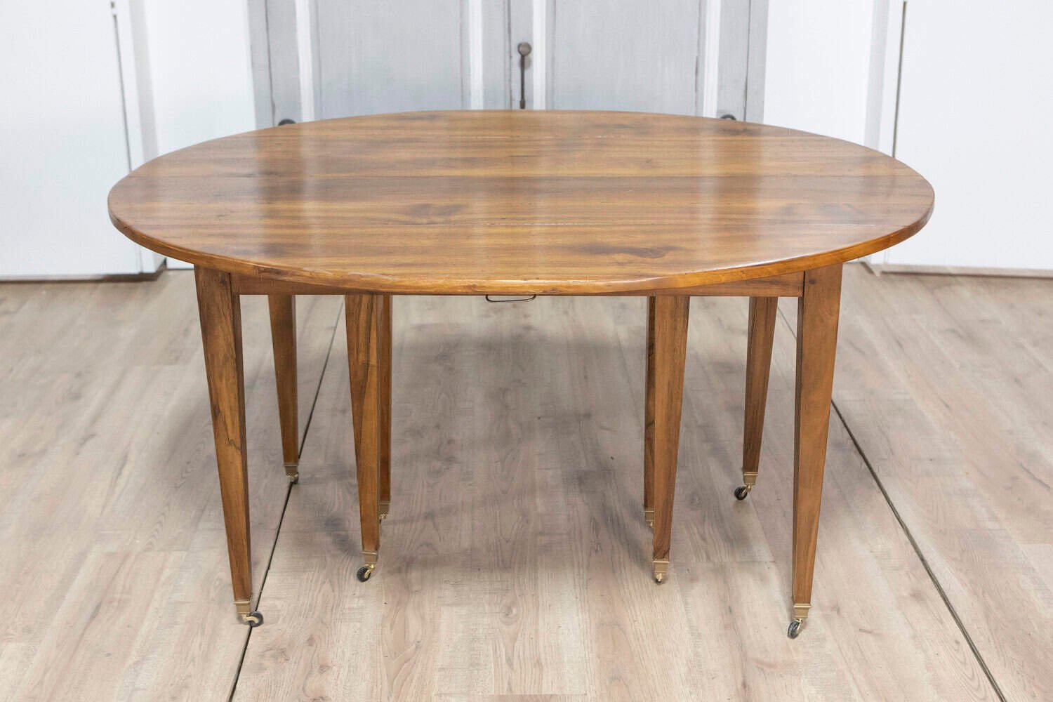 20th Century French Walnut Extension Dining Table With Five Leaves, Tapered Legs on Casters - JAA