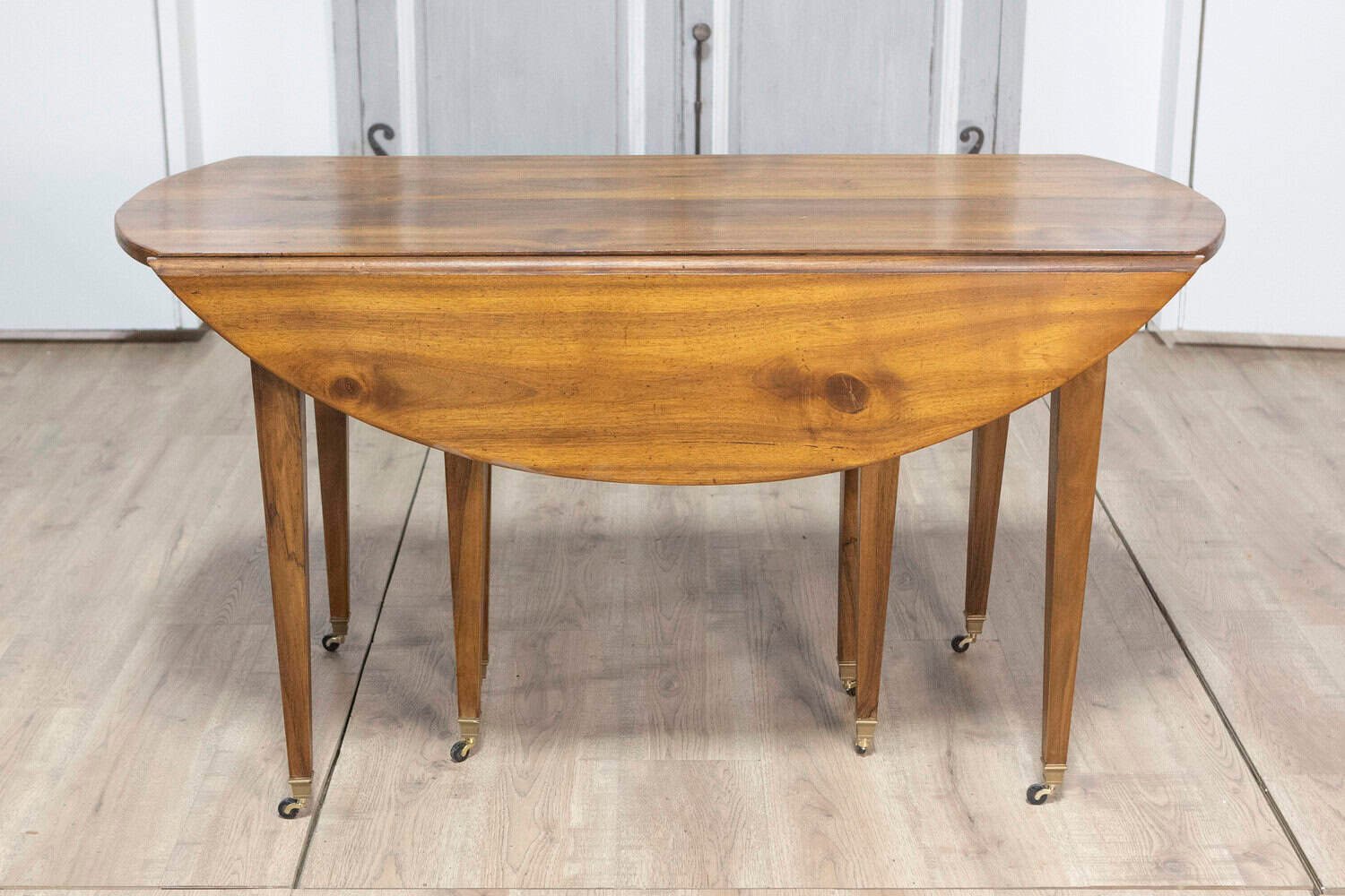 20th Century French Walnut Extension Dining Table With Five Leaves, Tapered Legs on Casters - JAA