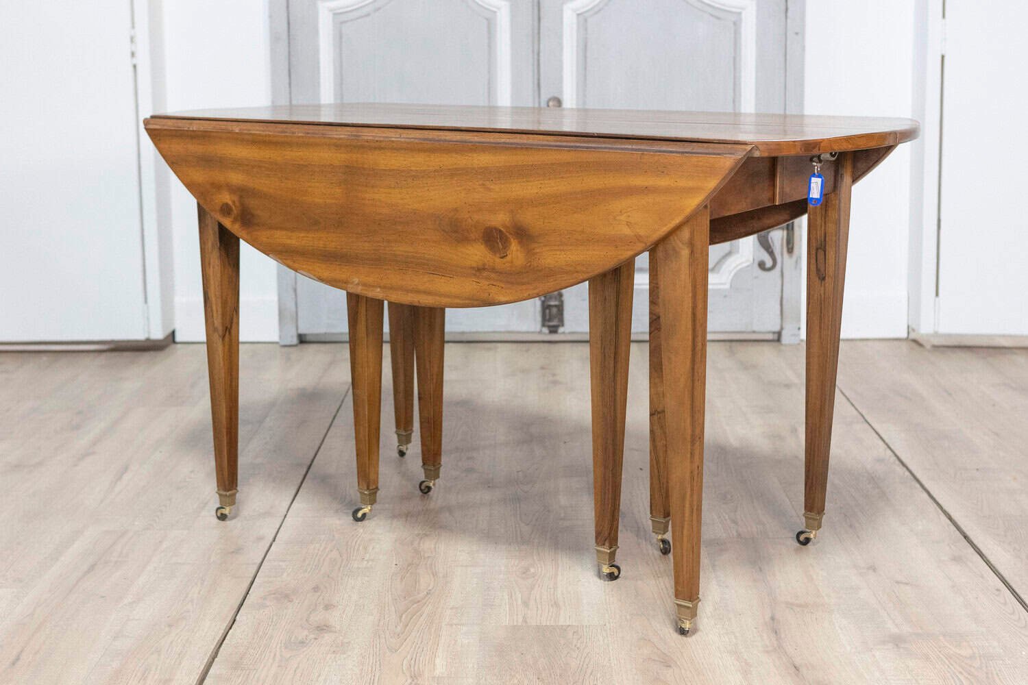20th Century French Walnut Extension Dining Table With Five Leaves, Tapered Legs on Casters - JAA