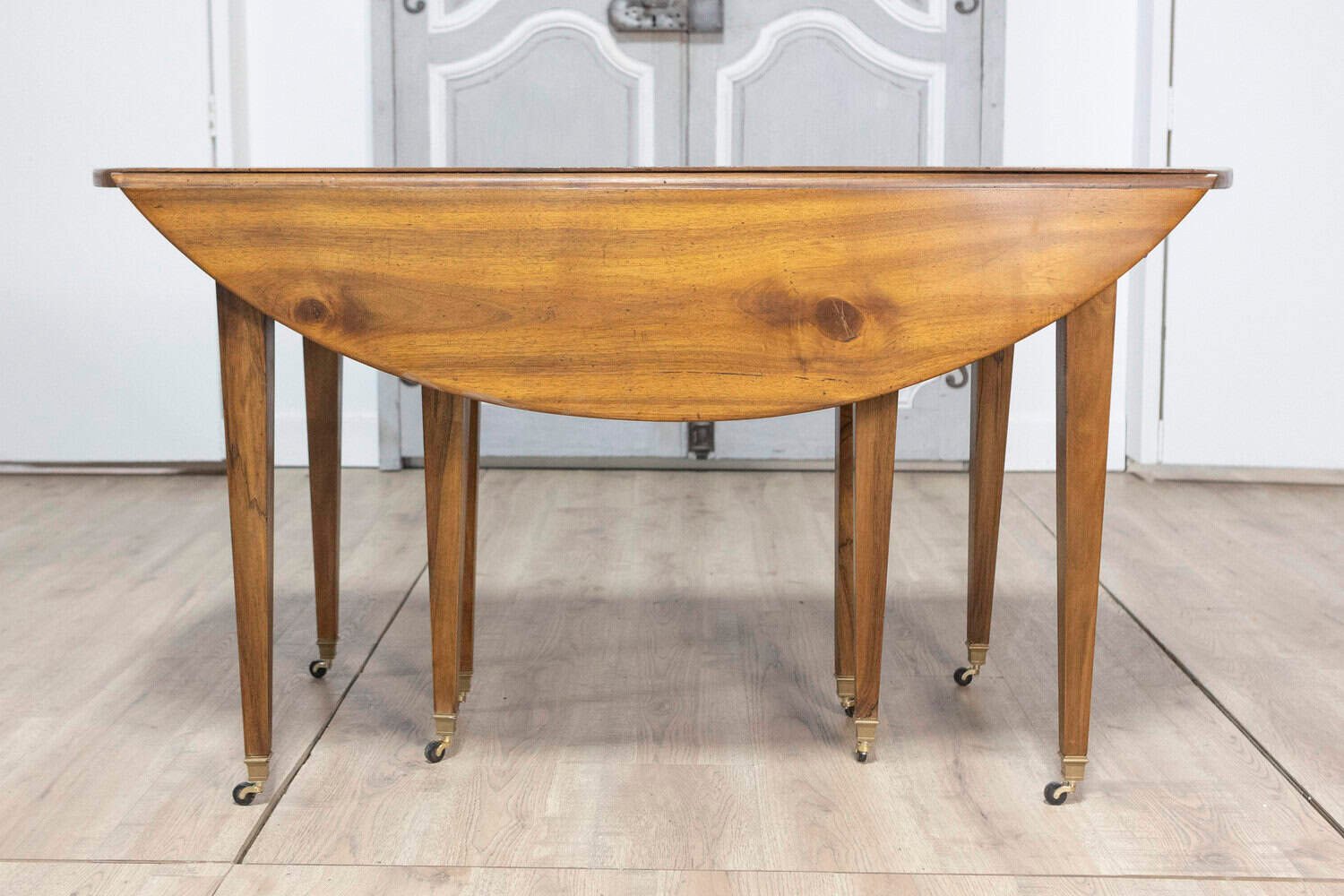 20th Century French Walnut Extension Dining Table With Five Leaves, Tapered Legs on Casters - JAA