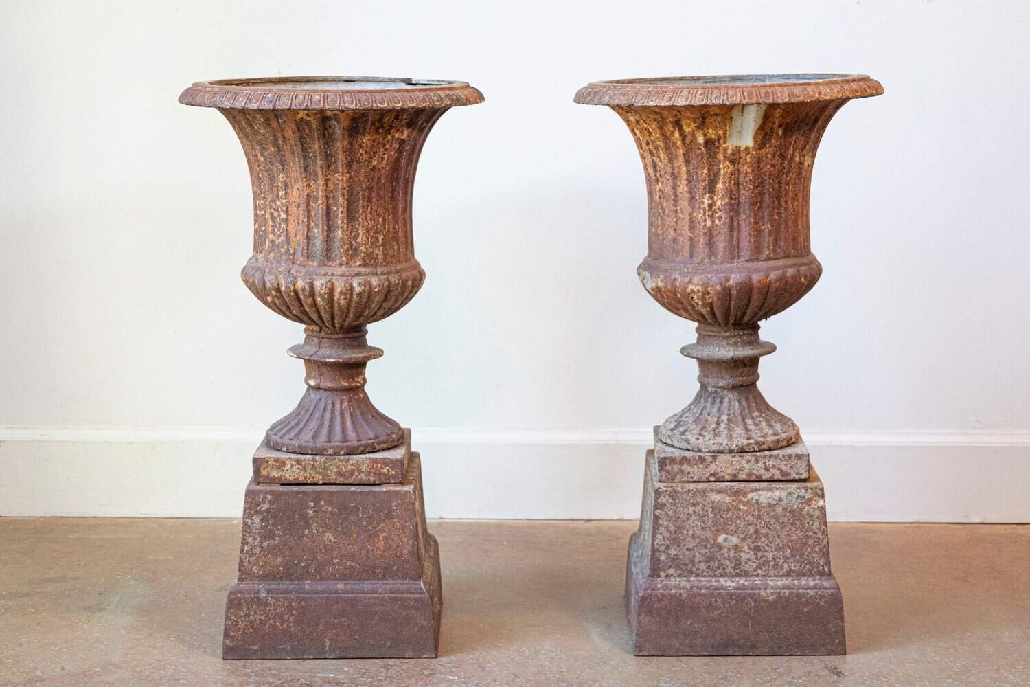 French 19th Century Pair of Iron Médicis Vases on Stepped Pedestals with Patina - JAA