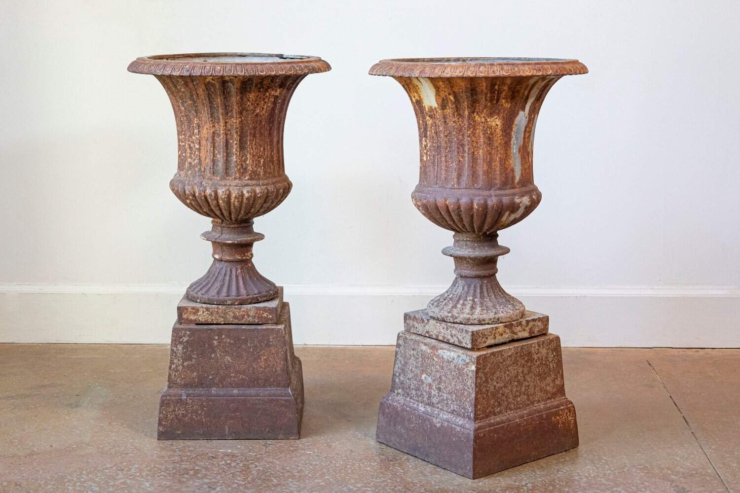 French 19th Century Pair of Iron Médicis Vases on Stepped Pedestals with Patina - JAA