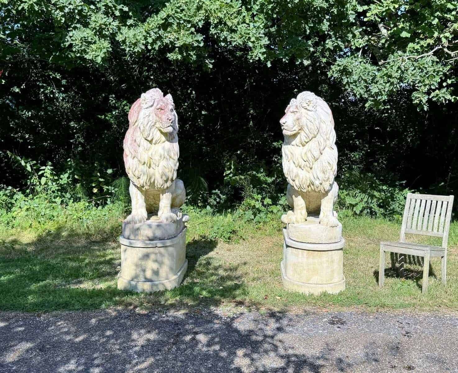 English 20th Century Pair of Monumental Cast-Stone Lions on Pedestals with Weathered Patinas - JAA