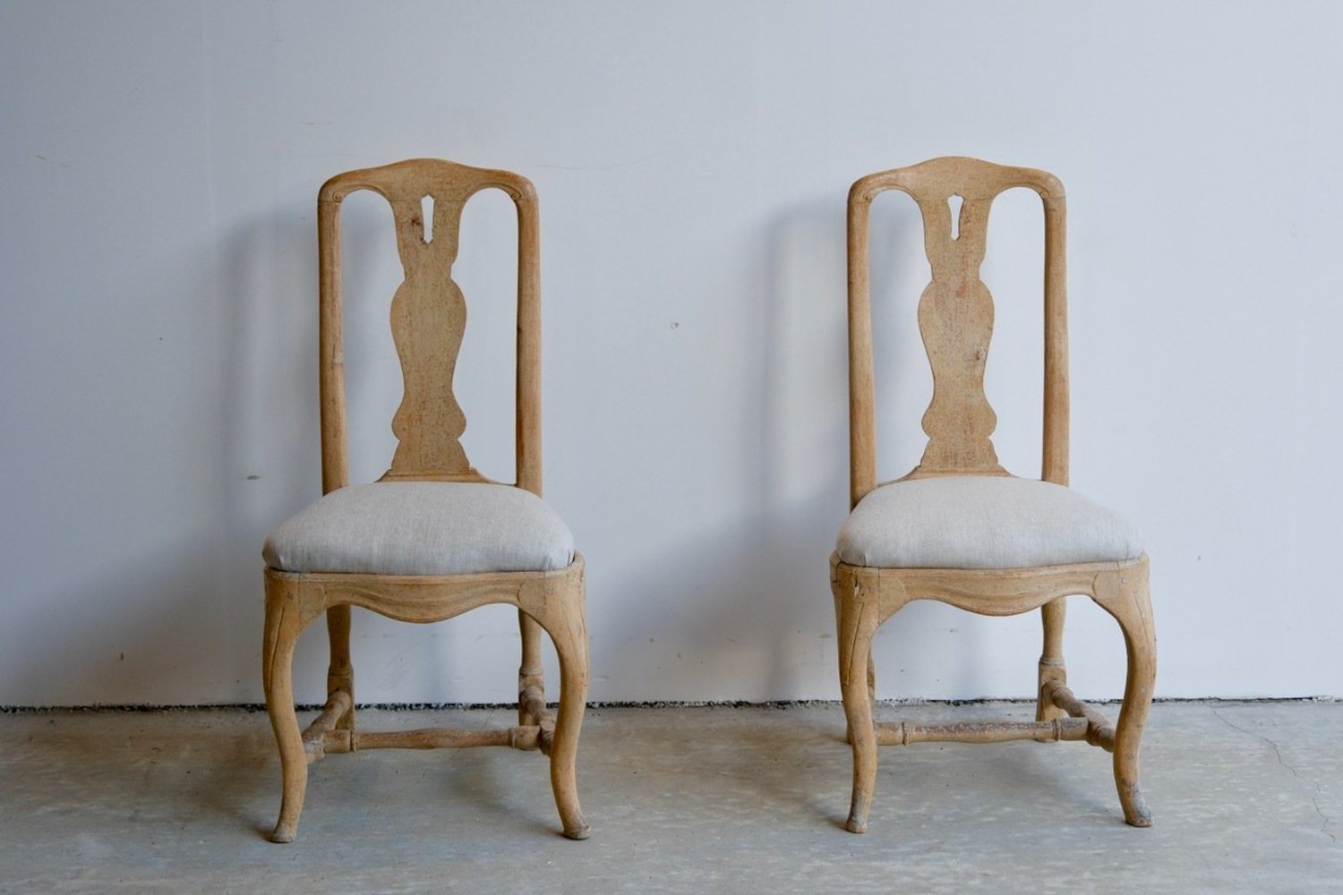 A period pair of Stockholm made Rococo chairs, scraped to original paint and newly covered in linen circa 1770 - JAA