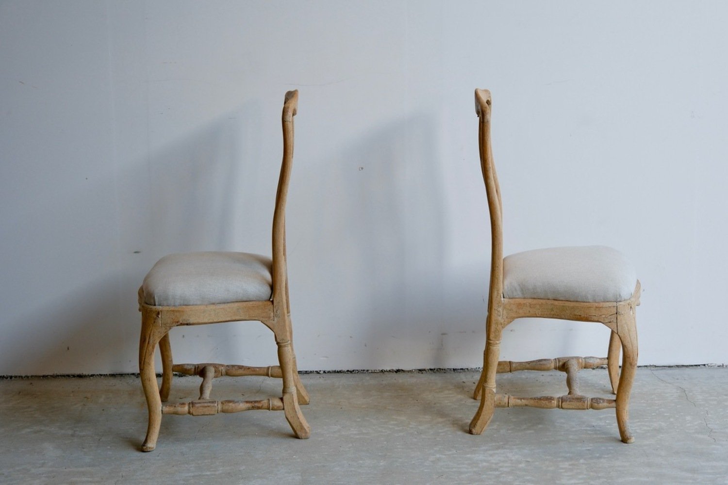 A period pair of Stockholm made Rococo chairs, scraped to original paint and newly covered in linen circa 1770 - JAA