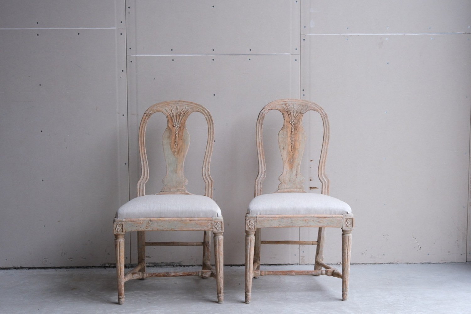 A pair of provincial period Gustavian Chairs Scraped to original paint and newly covered in linen. circa 1800 - JAA