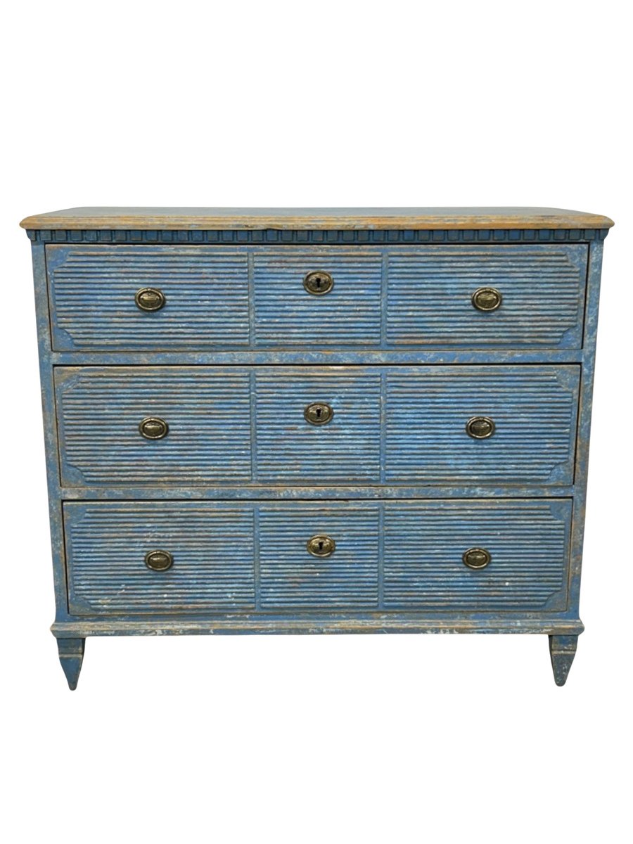 A beautiful and simple Swedish chest of drawers in a light blue with a deep patina