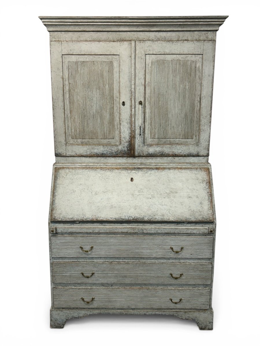 A beautiful antique two-piece light grey cupboard.