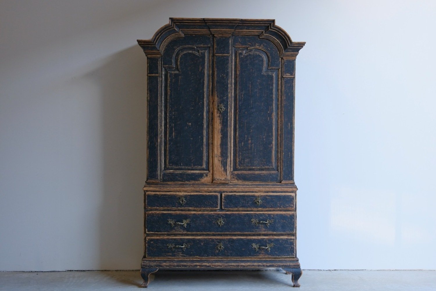 A period rococo cabinet with unusual door panels repainted in black and with a bluish grey interiorior. Original hardware circa 1760 - JAA